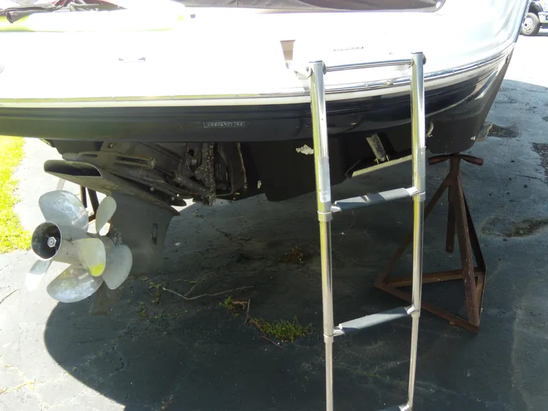 Slide: The Image of 2008 Chaparral SSX 276 boat stern with ladder and propeller on a stand. - 32