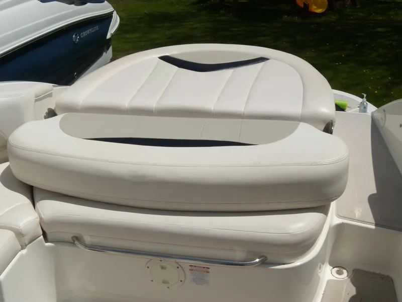Slide: The Image of 2008 Chaparral SSX 276 boat seating area with white cushioned upholstery. - 6