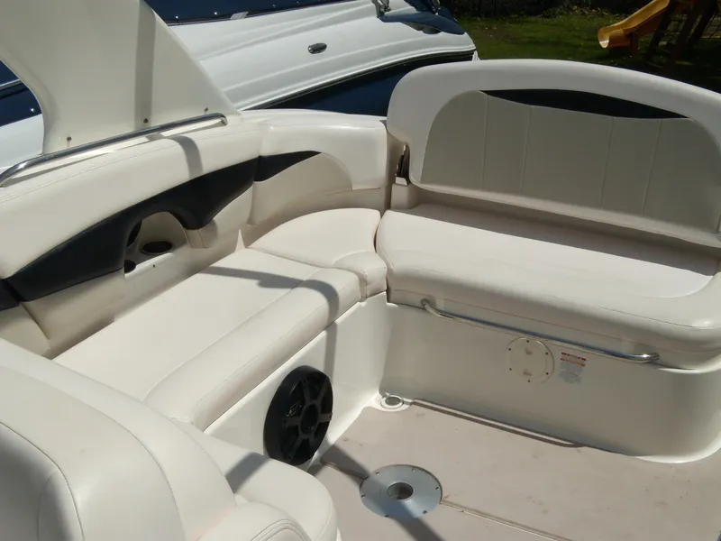 Slide: The Image of 2008 Chaparral SSX 276 boat interior with white seating and speaker. - 8