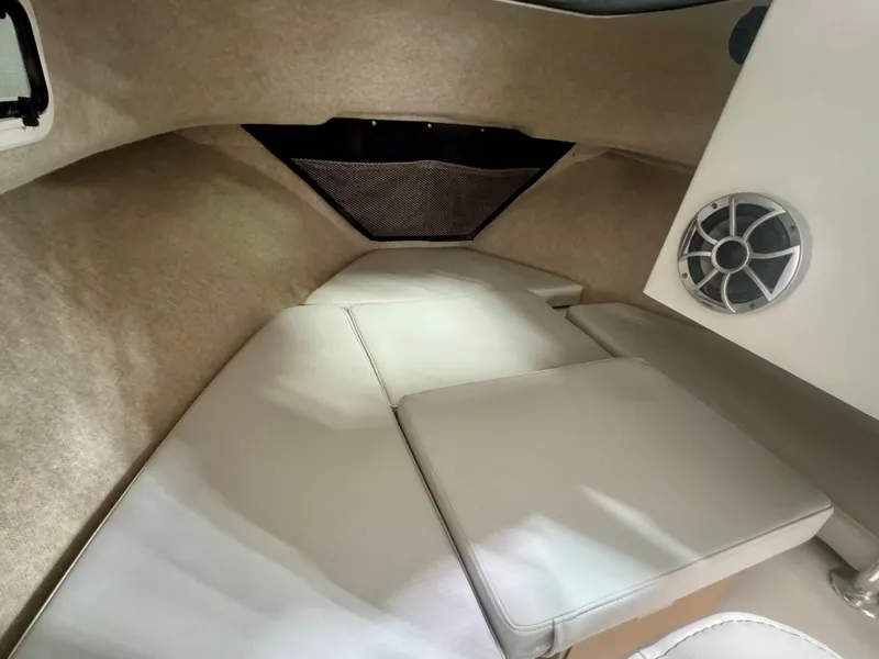 Slide: The Image of 2025 Parker 2120 Sport Cabin interior with cushioned seating and speaker. - 7