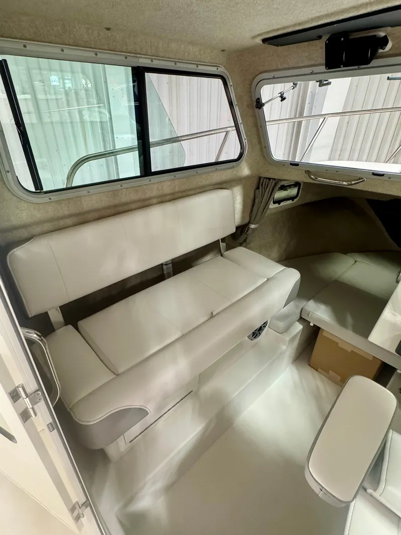 Slide: The Image of 2025 Parker 2120 Sport Cabin interior with seating and windows. - 9