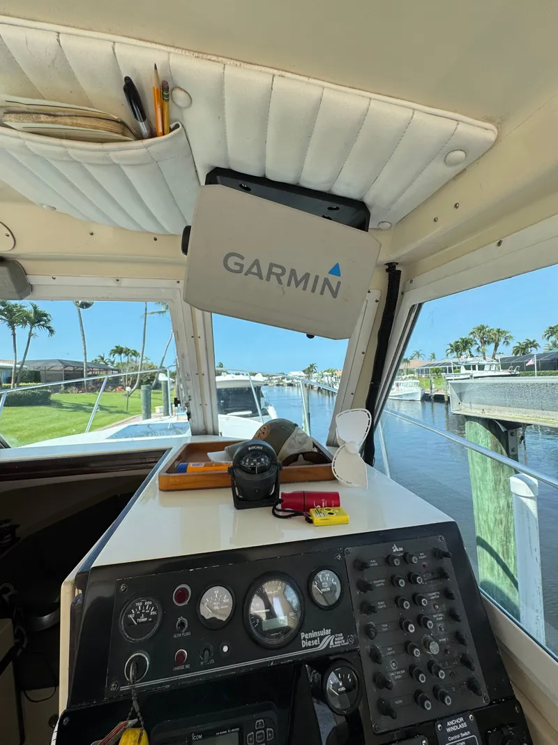 Slide: The Image of Interior of a 1996 Albin Tournament Express boat with Garmin navigation system. - 13