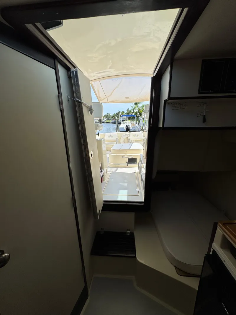 Slide: The Image of Interior view of 1996 Albin Tournament Express boat, showing cabin and deck area. - 21