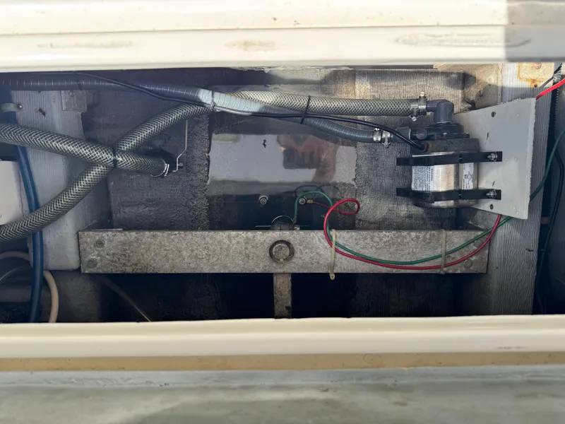 Slide: The Image of 1996 Albin Tournament Express engine compartment with hoses and wiring. - 25