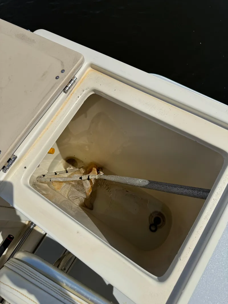 Slide: The Image of Open storage compartment on a 1996 Albin Tournament Express boat. - 7