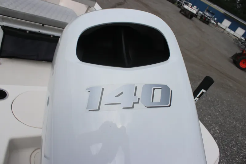 Slide: The Image of 2024 Carolina Skiff 21 LS boat with 140 horsepower engine, outdoor setting. - 10