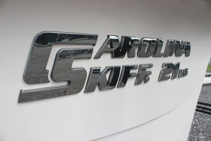 Slide: The Image of 2024 Carolina Skiff 21 LS logo on boat exterior, showcasing sleek design and branding. - 11