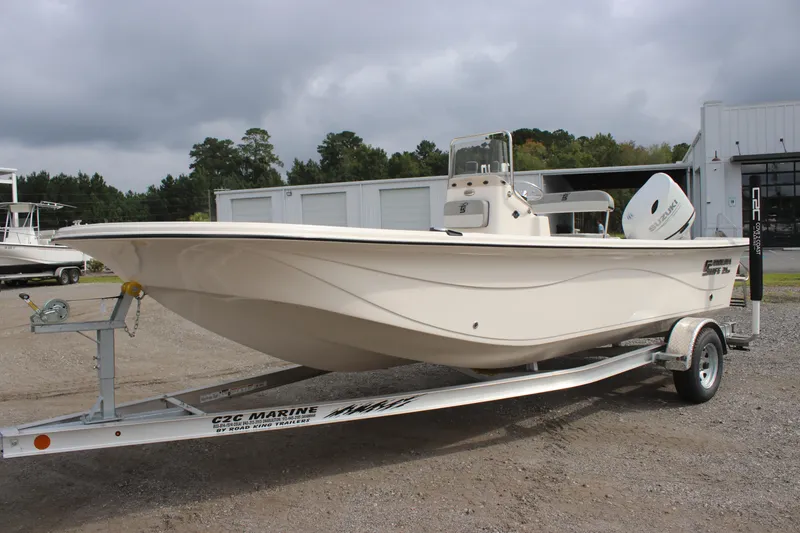 Slide: The Image of 2024 Carolina Skiff 21 LS boat on trailer, parked outdoors. - 12