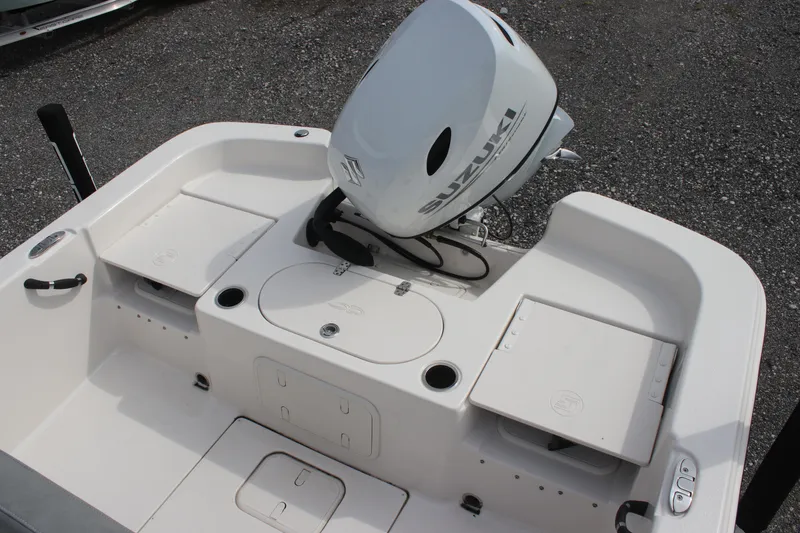 Slide: The Image of 2024 Carolina Skiff 21 LS boat with Suzuki outboard motor, rear deck view. - 14