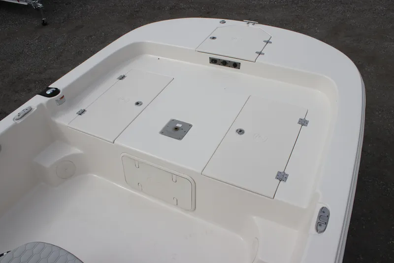 Slide: The Image of 2024 Carolina Skiff 21 LS boat deck with storage compartments. - 21