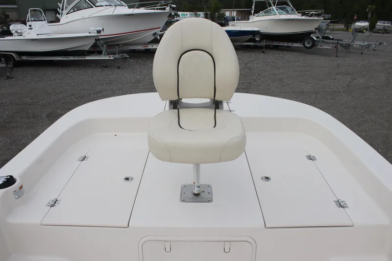 Slide: The Image of 2024 Carolina Skiff 21 LS boat with a central swivel seat on deck. - 25