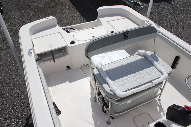 Slide: The Image of 2024 Carolina Skiff 21 LS boat interior with seating and storage compartments. - 5