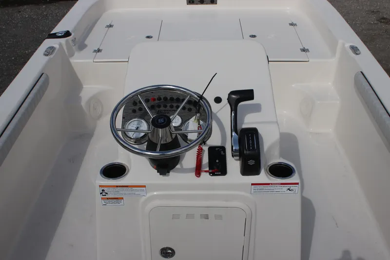 Slide: The Image of 2024 Carolina Skiff 21 LS boat console with steering wheel and controls. - 6