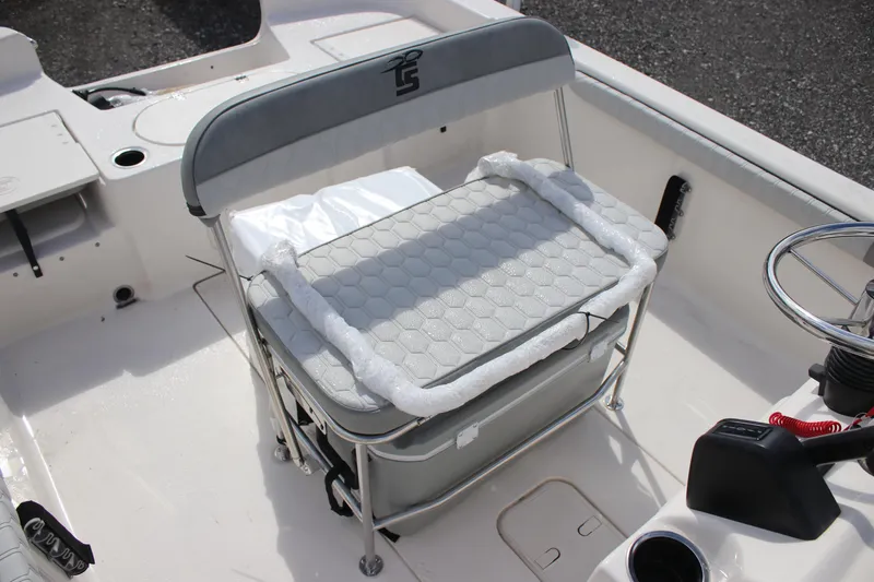 Slide: The Image of 2024 Carolina Skiff 21 LS boat interior with cushioned seating and steering console. - 7