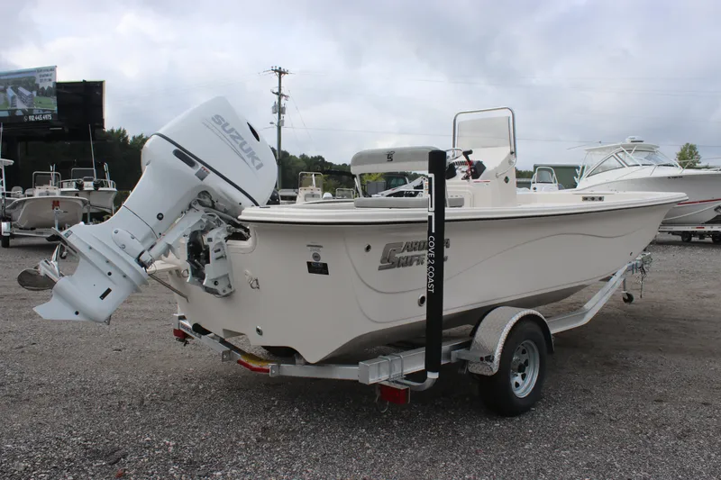 Slide: The Image of 2024 Carolina Skiff 21 LS boat with Suzuki outboard motor on trailer. - 8