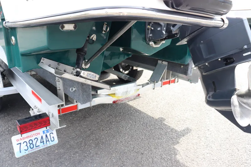 Slide: The Image of 2022 Ranger Tugs R-25 boat on trailer, showing rear view with Washington license plate. - 11