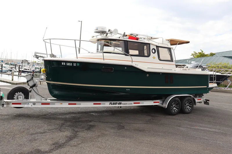 Slide: The Image of 2022 Ranger Tugs R-25 boat on trailer at marina. - 5