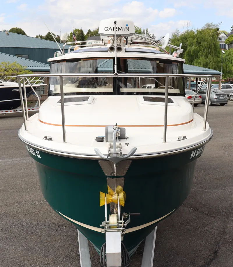 Slide: The Image of 2022 Ranger Tugs R-25 boat with Garmin equipment, docked on a trailer. - 7