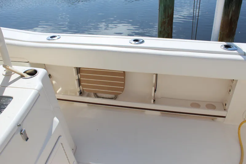 Slide: The Image of 2018 Grady-White Canyon 306 boat interior with seating and rod holders. - 25