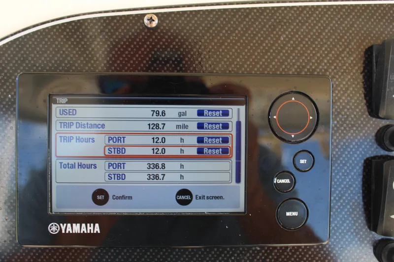 Slide: The Image of Yamaha display on 2018 Grady-White Canyon 306 showing trip data and engine hours. - 9