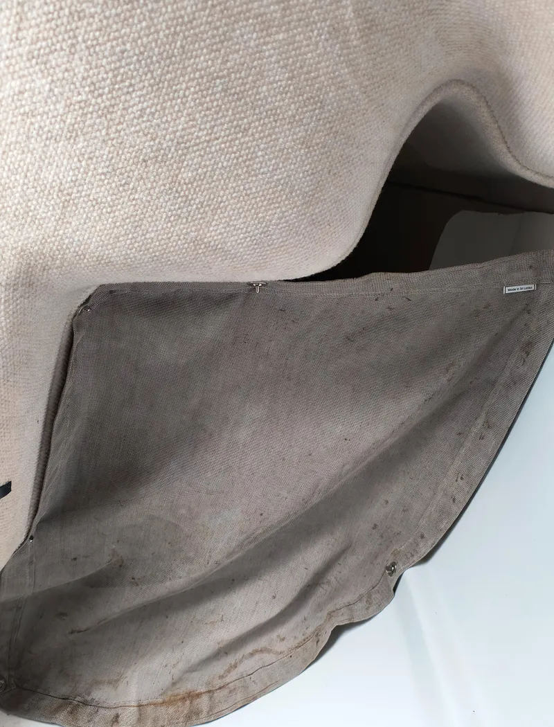 Slide: The Image of Beige fabric interior of a 2008 Hunter 216 sailboat. - 6