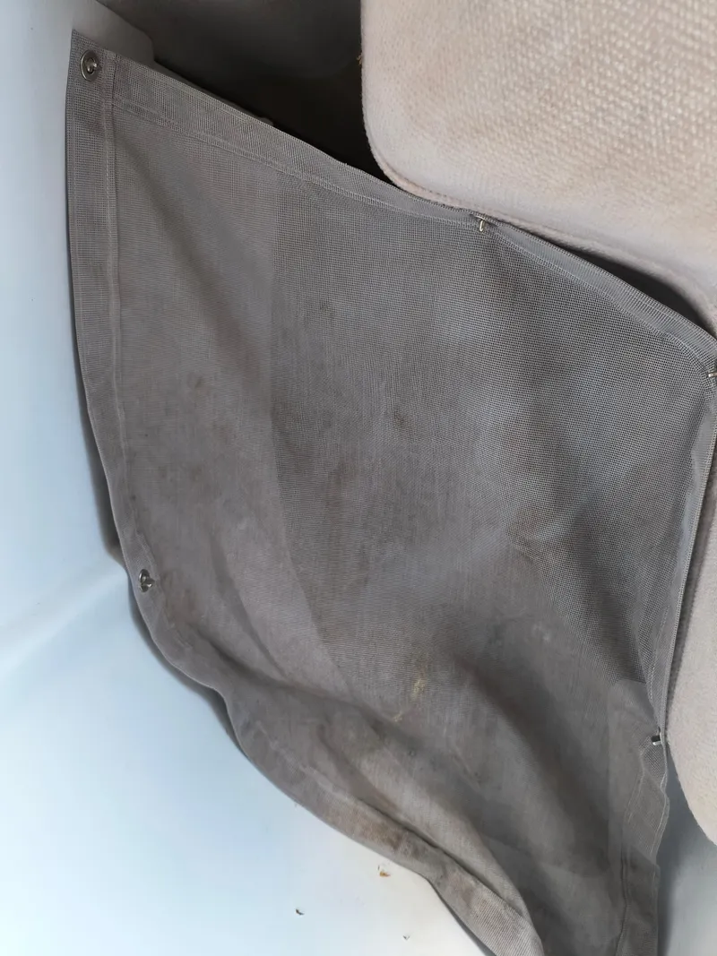 Slide: The Image of Storage pocket in a 2008 Hunter 216 sailboat interior. - 8