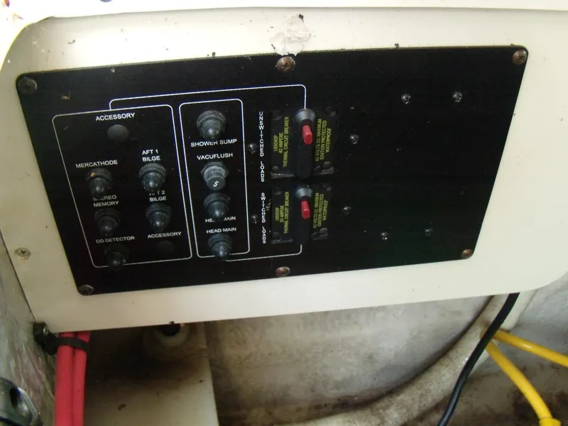 Slide: The Image of Control panel of a 2006 Crownline 260 LS boat with various switches and labels. - 10