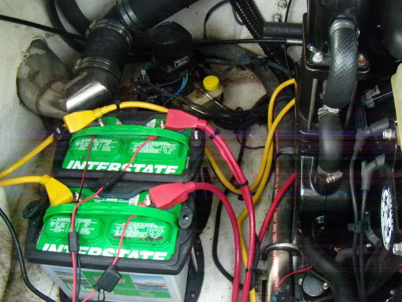 Slide: The Image of 2006 Crownline 260 LS boat engine compartment with Interstate batteries and wiring. - 11