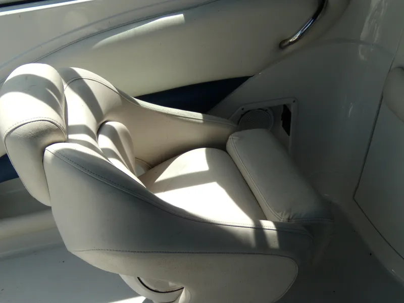 Slide: The Image of 2006 Crownline 260 LS boat interior seat with white upholstery and sleek design. - 12