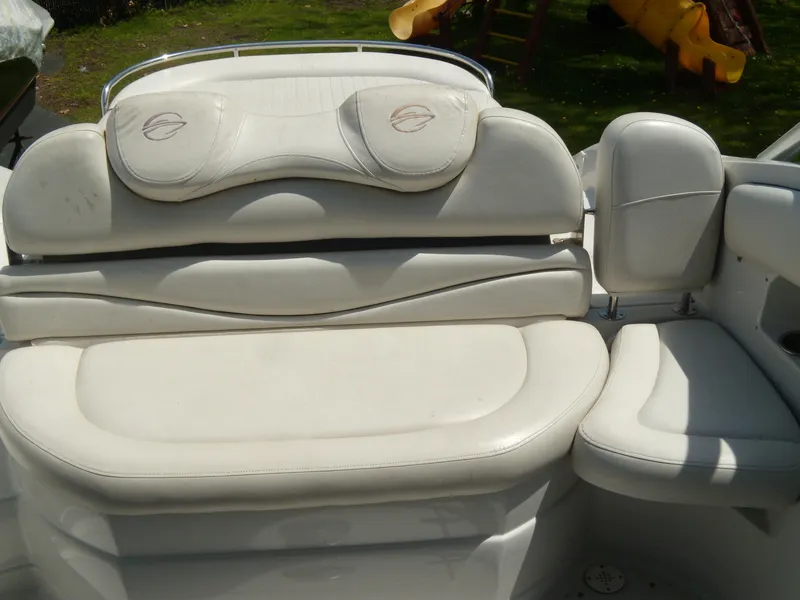 Slide: The Image of 2006 Crownline 260 LS boat interior with white cushioned seating. - 5