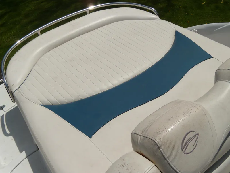 Slide: The Image of 2006 Crownline 260 LS boat interior with white and blue seating. - 6
