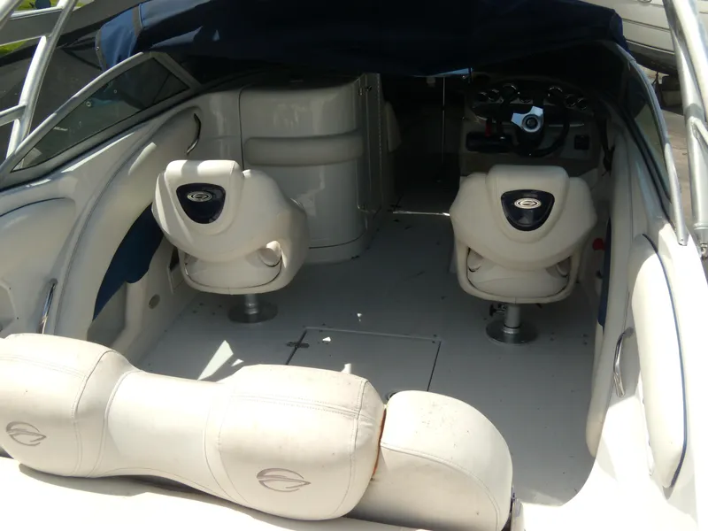 Slide: The Image of 2006 Crownline 260 LS boat interior with seating and steering area. - 8