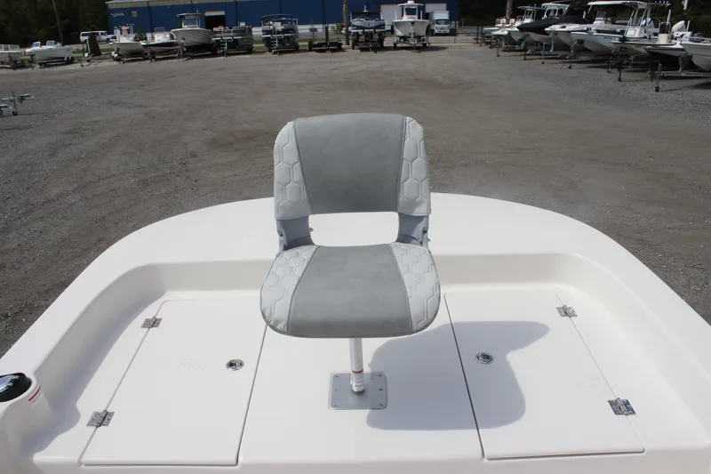 Slide: The Image of 2025 Carolina Skiff 19 LS boat with a single swivel seat on deck. - 13
