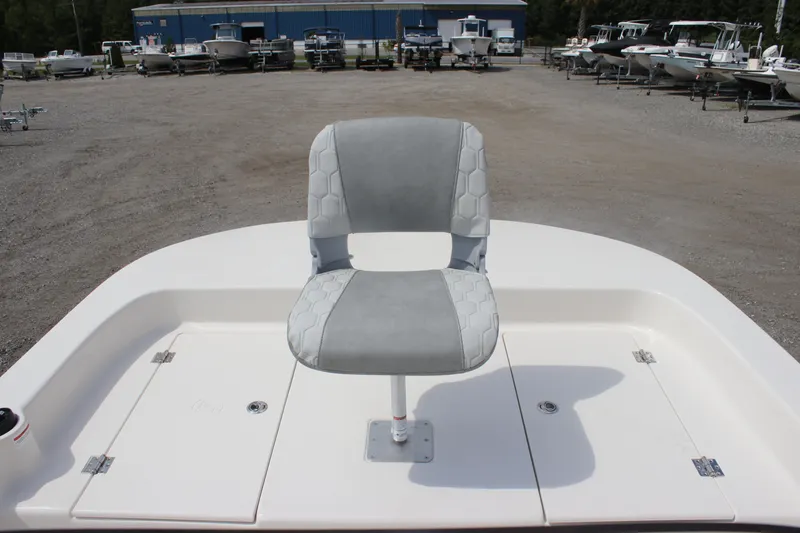 Slide: The Image of 2025 Carolina Skiff 19 LS boat with a single swivel seat on deck. - 14