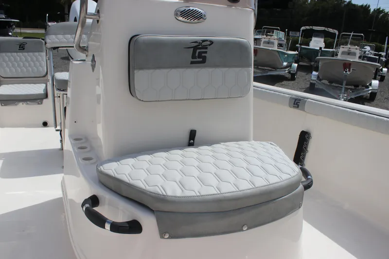 Slide: The Image of 2025 Carolina Skiff 19 LS boat interior with cushioned seating and modern design. - 16