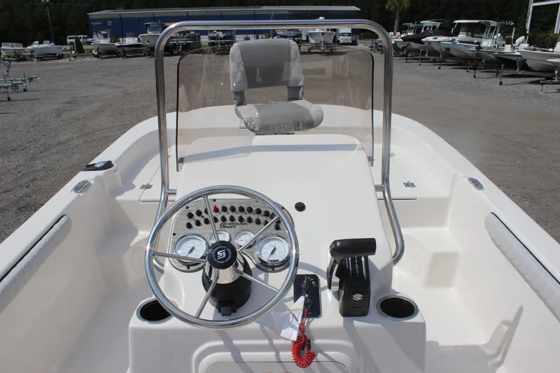 Slide: The Image of 2025 Carolina Skiff 19 LS boat dashboard with steering wheel and controls. - 20