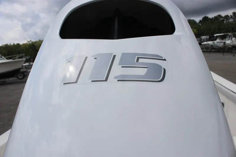 Slide: The Image of Close-up of 2025 Carolina Skiff 19 LS outboard engine with '115' marking. - 6