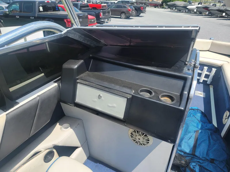Slide: The Image of 1988 Bayliner 2150 Capri boat interior with seating and storage compartments. - 13