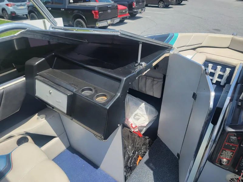 Slide: The Image of 1988 Bayliner 2150 Capri boat interior with seating and storage compartments. - 7