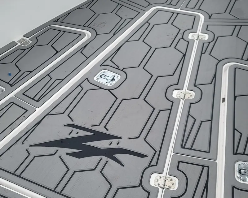 Slide: The Image of Deck of 2006 Donzi 32 ZF boat with geometric pattern and logo. - 11