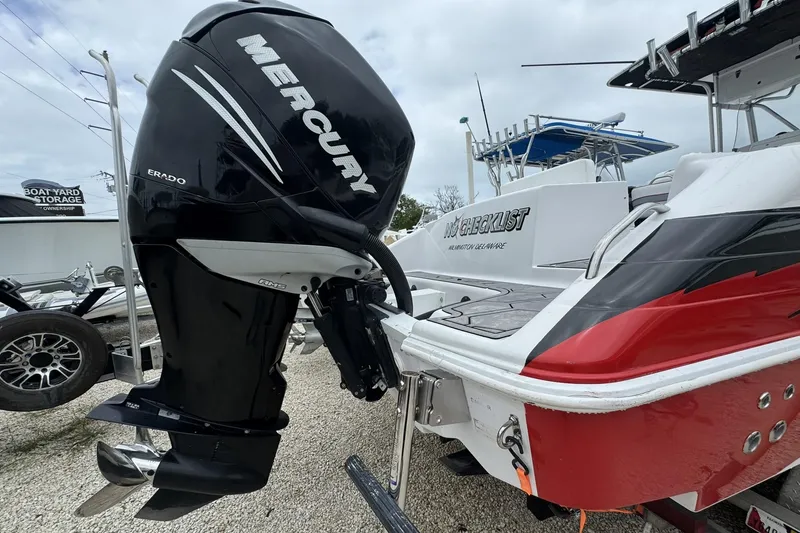 Slide: The Image of 2006 Donzi 32 ZF boat with Mercury outboard engine, parked on gravel. - 12