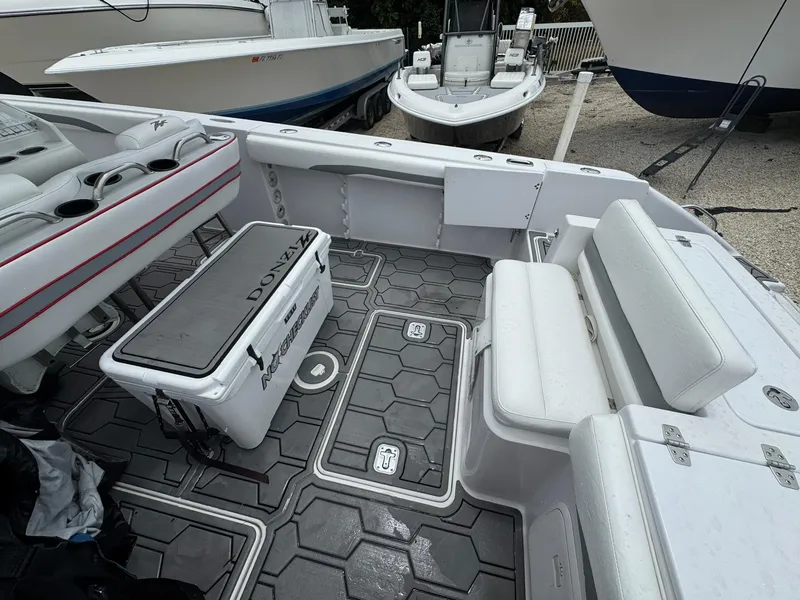 Slide: The Image of 2006 Donzi 32 ZF boat interior with seating and storage compartments. - 6