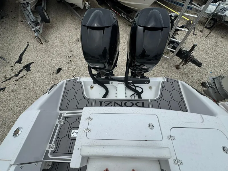 Slide: The Image of 2006 Donzi 32 ZF boat with dual outboard motors, viewed from the stern. - 7