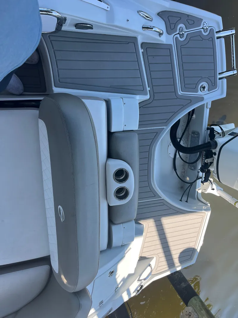 Slide: The Image of 2020 Crownline 280 XSS boat deck with seating and cup holders. - 12