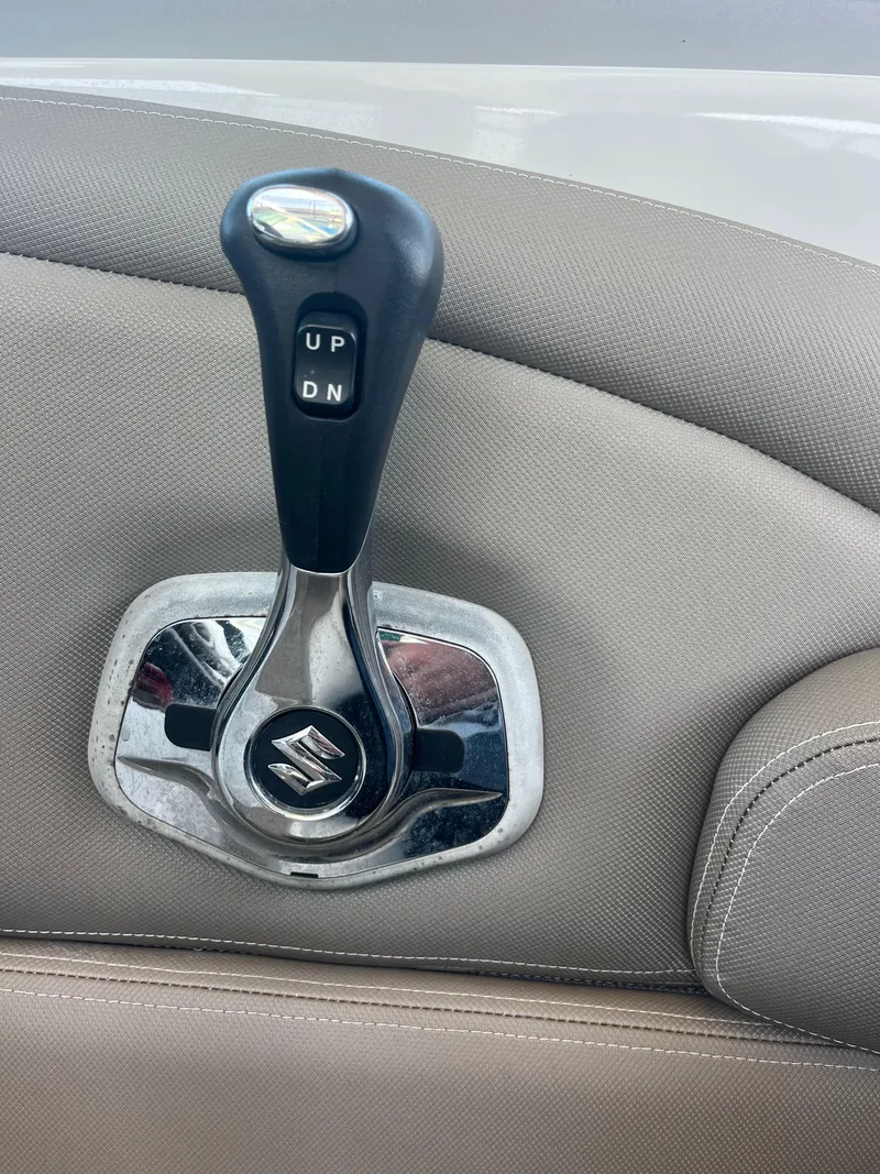 Slide: The Image of Throttle control lever on 2020 Crownline 280 XSS boat interior. - 26