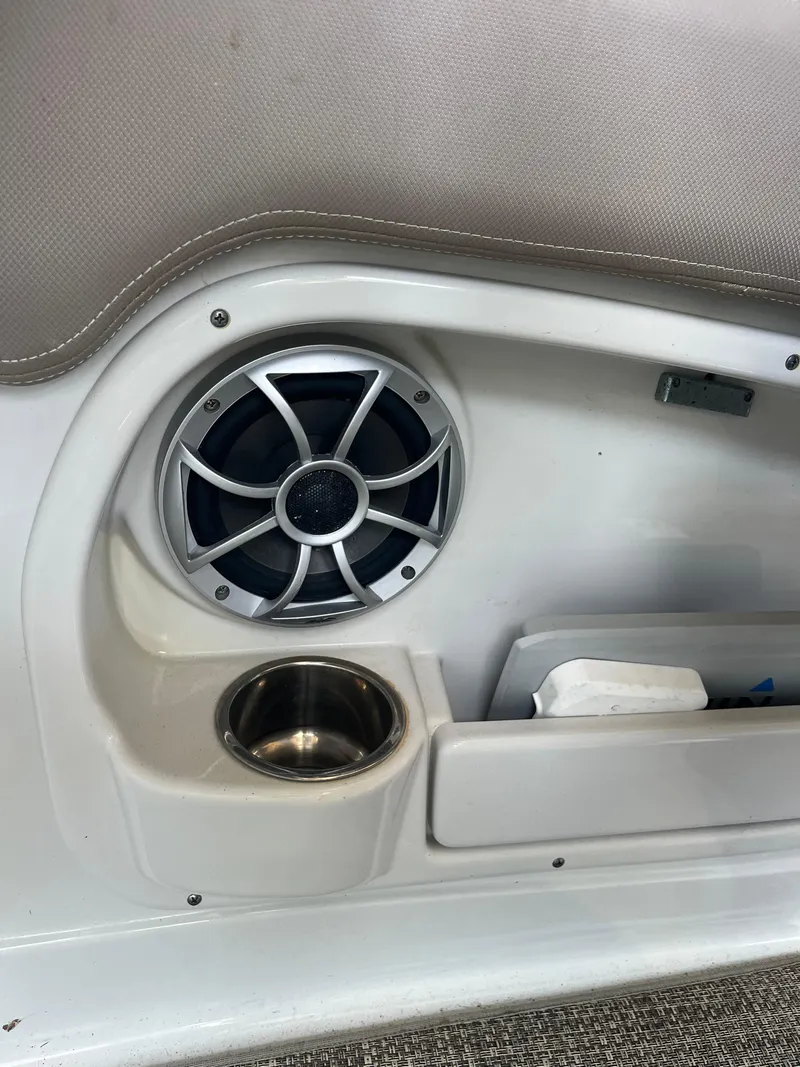 Slide: The Image of Crownline 280 XSS 2020 boat interior with speaker and cup holder. - 27