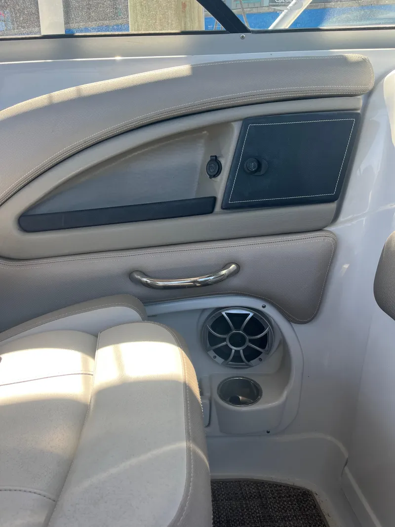 Slide: The Image of Interior view of 2020 Crownline 280 XSS boat, featuring seating and speaker. - 28