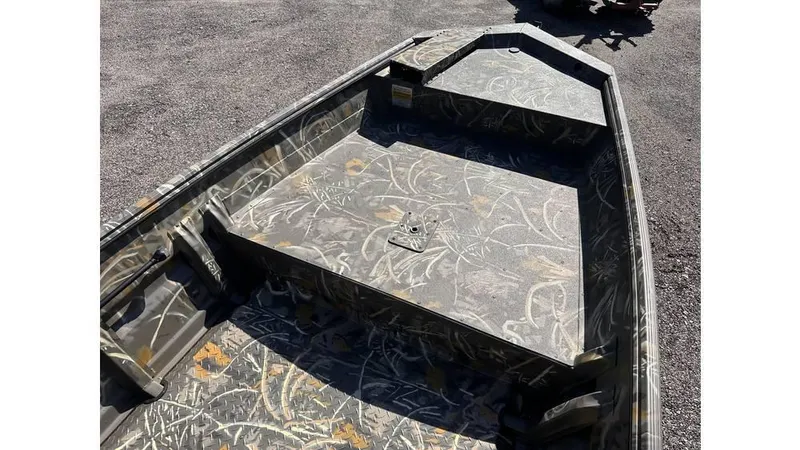 Slide: The Image of 2025 War Eagle 648LDV Sportsman boat with camouflage interior design. - 6