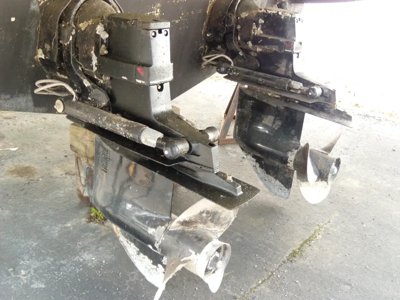 Slide: The Image of Outboard motors of a 2000 Maxum 3300 SCR boat on dry dock. - 3