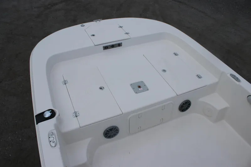 Slide: The Image of 2025 Carolina Skiff 21 LS boat deck with storage compartments and speakers. - 5